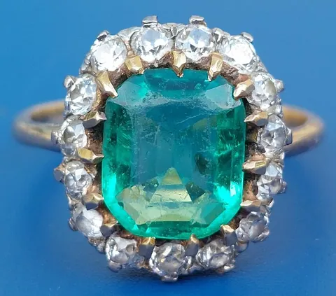 Emerald and diamond cluster ring £3,500