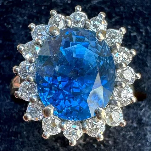 6 carat natural Burmese sapphire and diamond cluster ring as an engagement ring for a double estimate £6,400.