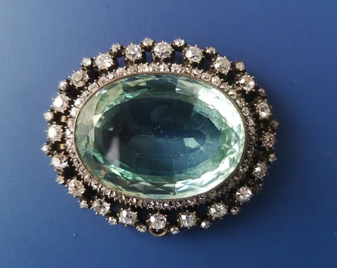 large Victorian oval aquamarine & diamond brooch set with numerous small diamonds and sapphires