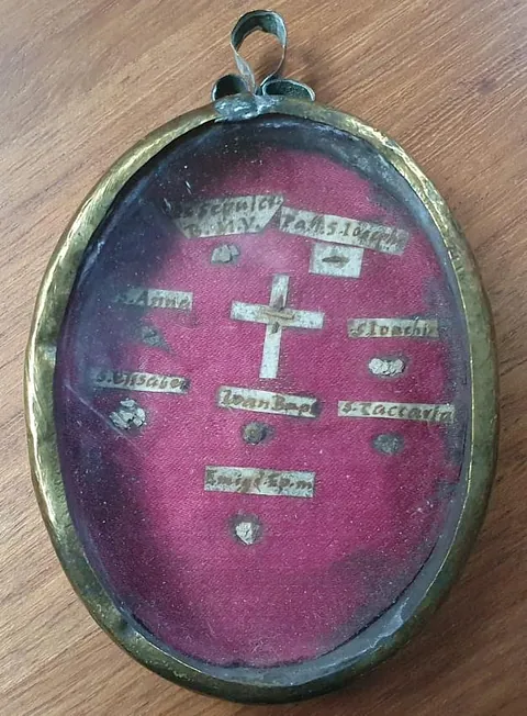 small antique oval reliquary, just a few inches long, included in its contents, fragments of the 'True Cross'