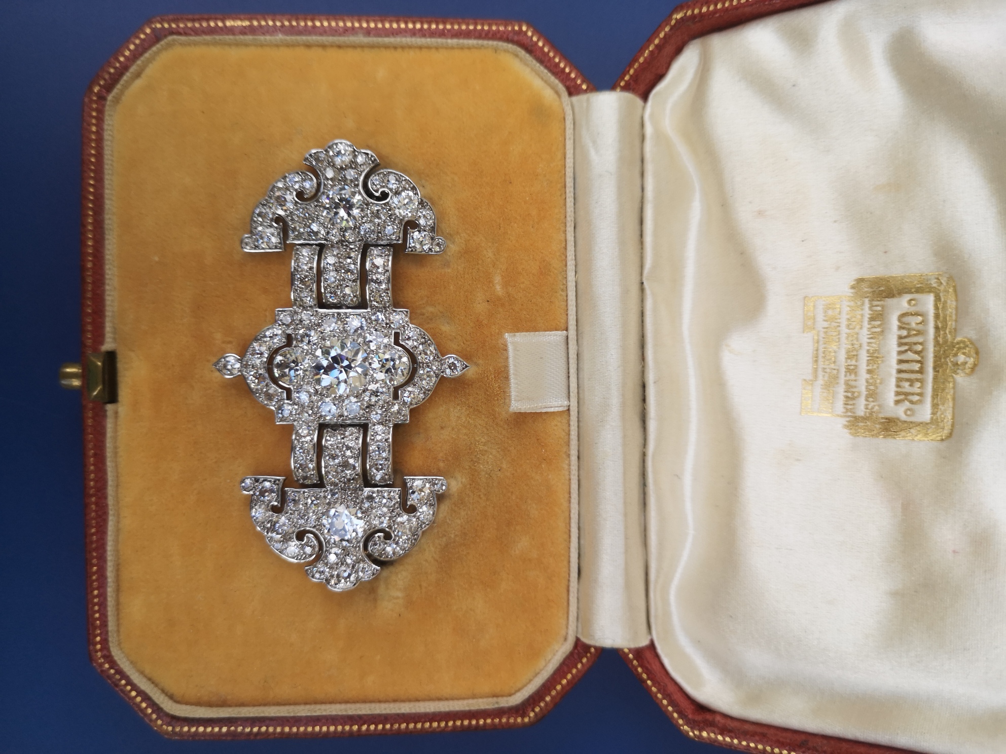 Art deco diamond set platinum brooch unsigned, fitted into a Cartier box, sold for £13,000