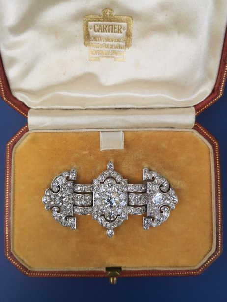 Art deco diamond set platinum brooch unsigned, fitted into a Cartier box, sold for £13,000