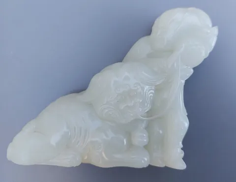 small white jade carving of a Temple Dog